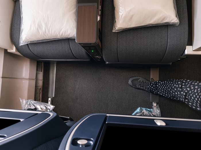 ANA Premium Economy cabin, looking down at the seat pitch