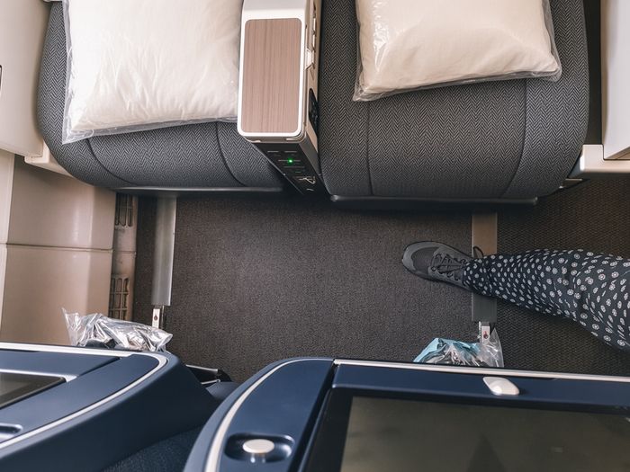 British Airways World Traveller Plus cabin, looking down at the seat pitch