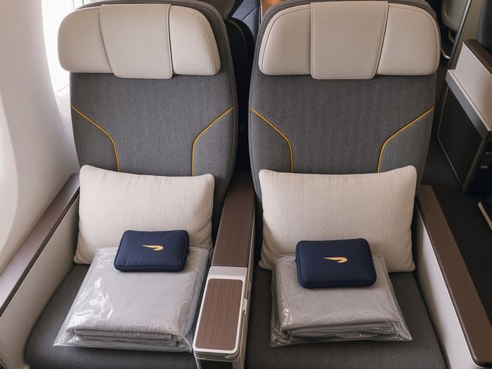 Lufthansa Premium Economy seats with pillow, blanket and amenity kit